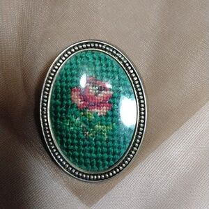 Flowered brooch in frame